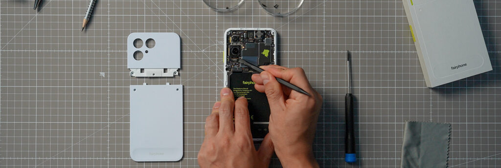 Someone is repairing an opened Fairphone (Gen. 6)